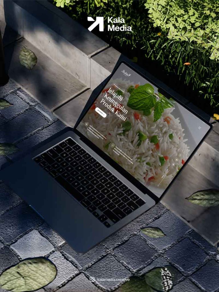 Tampilan antarmuka website Shahin.co.id pada layar laptop di atas meja kerja.